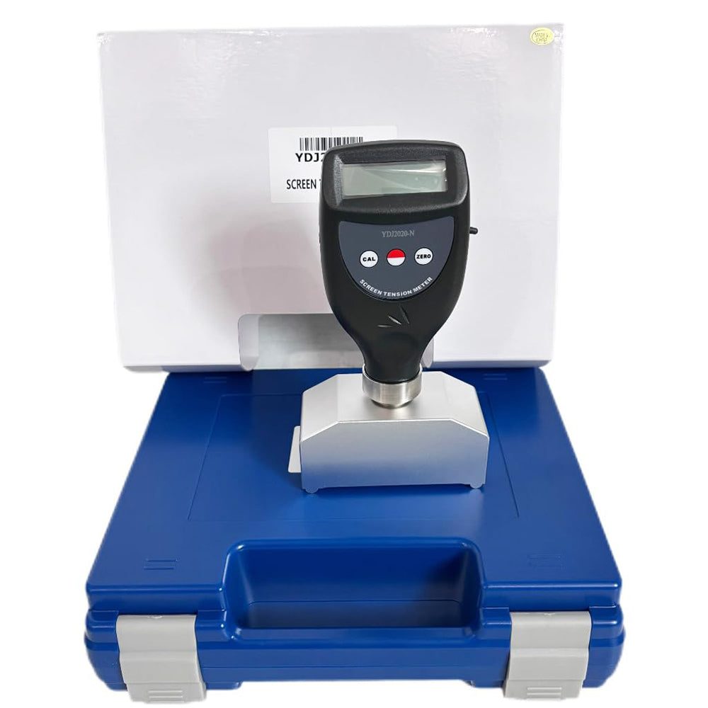 A digital screen tension meter standing on its calibration block inside a protective carry case